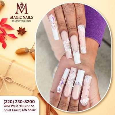 Elevate your elegance with our white French nails adorned with dazzling rhinestones and intricate 3D floral designs.