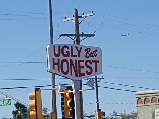 Our historic 'Ugly But Honest' sign on the corner of 5 points