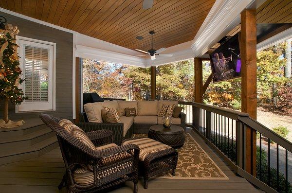 Open porch with drop down TV - designed and built by Atlanta Decking.