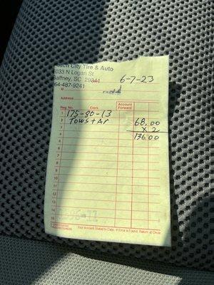 Total price for two trailer tires plus greasing the axle!