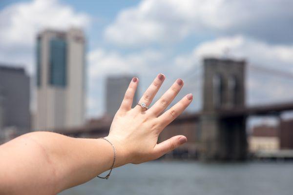 Beautiful 1.2 ct. Tiffany Setting Engagement Ring with a Diamond Band perfected by DreamStone shot at Brooklyn Bridge Park!