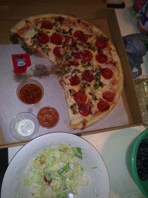 Delivery pizza and fresh salad. Yum.