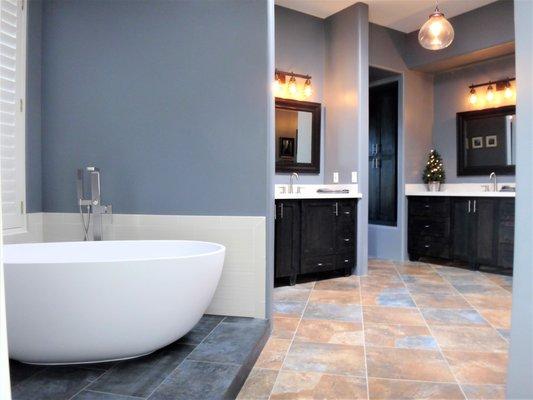 Stand alone tub with new vanities and quartz counter tops