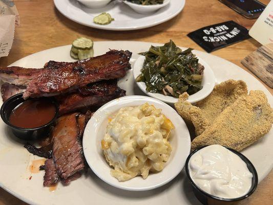 Three Meat Combo plate, Baby Back Ribs, Fried Catfish, and brisket with greens and mac n cheese.