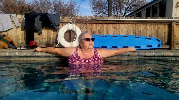 Kristy relaxes in the water.