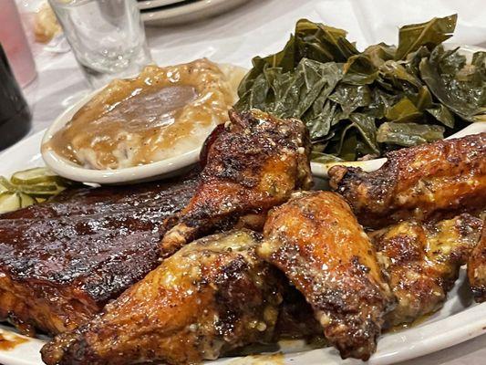 Combo 2 pick St. Louis ribs and smoked wings (spicy garlic park) w/ seasoned collards and mashed potatoes & gravy)