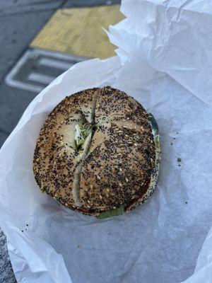 Salami sandwich on poppyseed bagel.