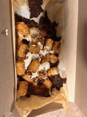 Burnt on the bottom cheesy tots...but somehow there is zero crispness on the tot. I can't even really explain it.