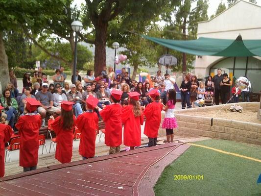 Our student graduates reciting a poem to their families at our culmination ceremony in June.