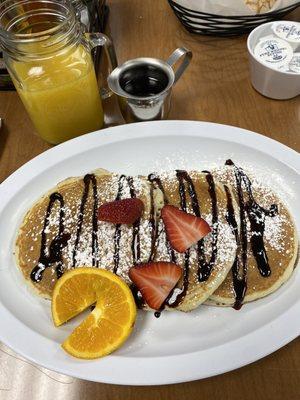 Chocolate chip pancakes and orange juice