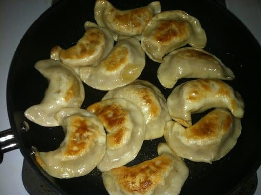 The meat pierogi as I fried them in a pan.