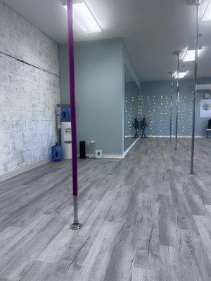 The studio! There are chrome poles and these silicone type of poles if you prefer to wear yoga pants, socks and long sleeve yoga suit.