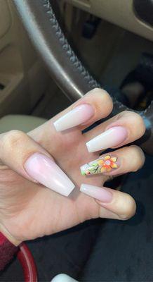 Ombré pink and white nails with flower.