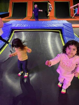 Daughter and niece jumping in the freestyle area.