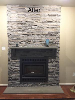 After- new high efficiency wood burning fireplace and stone facade.