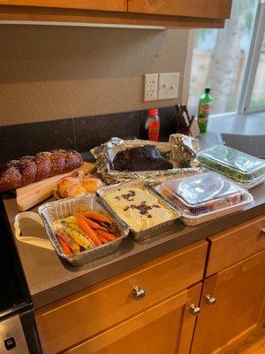 Complete dinner for 2, in reheat-able containers. Bread, carrots, truffle potato's, prime rib, lobster bisque and arugula beet salad.