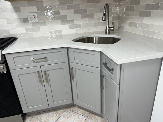 Initially the sink was going to be against the all. Altas suggested a corner sink.  Love it!