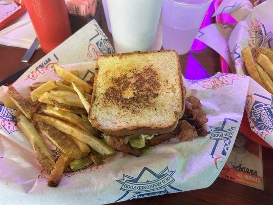 BLT Sandwich with French Fries.