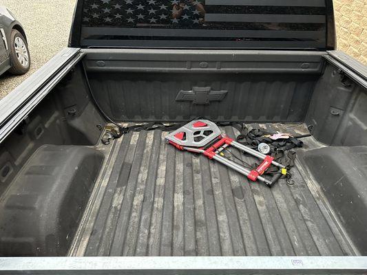 Inside the truck bed with no damage to the cover rails which is still attached.