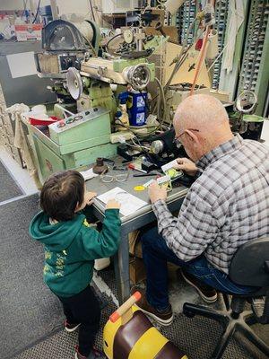 Kids get a chance to see the glasses manufacturing process in action.