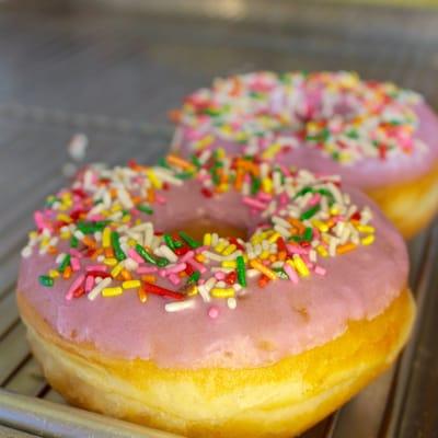 "Simpsons" donuts (as I call them). Yeast doughnuts with sprinkles and pink glaze