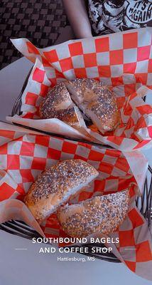 Two bagels: both on an everything bagel  Top: garden bagel Bottom: lox bagel