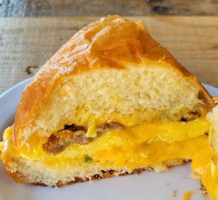 Breakfast Sandwich - Egg, Cheddar, Sausage, Sauce on Toasted Brioche Bun - Deeeelicioussss!