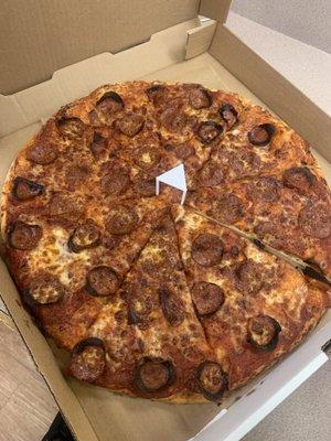 Over-cooked pepperoni pizza