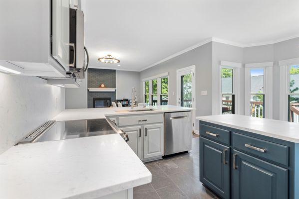 White Quartz countertops with contrast-colored island.