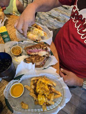 Chili cheese fries, a reuben, and a polish sausage.