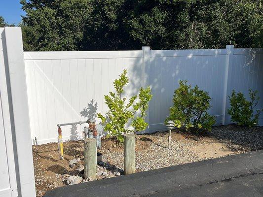 White Vinyl Privacy fence. Have an unsightly AC unit or electrical box? Ask about our enclosure options!