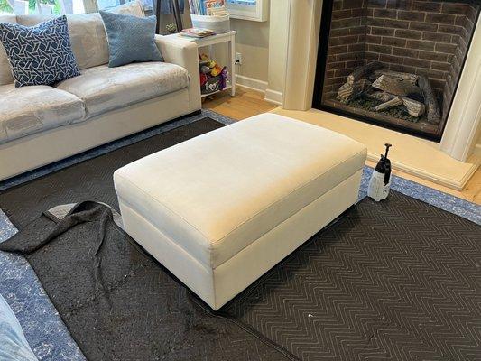 Upholstery cleaning with drop cloths to protect my rug.