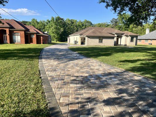 Driveway installed using Mega Olde Towne Pavers LionsBridge Color with Granite border