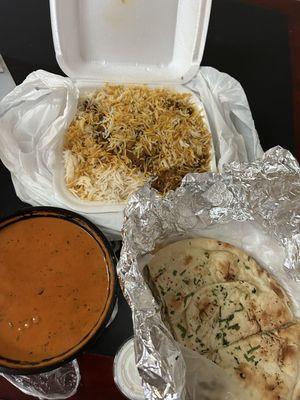 Goat biryani, butter chicken, and garlic naan