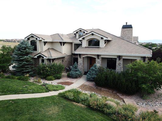 Exterior stucco painting and wood staining.