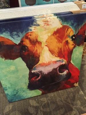 I counted a half a dozen different cow paintings and that's just the in-store inventory.