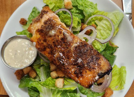 Half pound of salmon in the Salmon Caesar Salad.