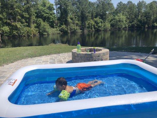 This is my son enjoying our patio and mini pool the next day