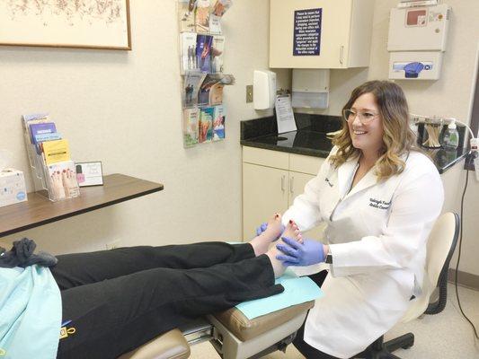 Dr. Alyssa Carroll works with a patient at Raleigh Foot & Ankle Center.