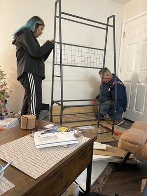 Daughter with All Around Handiman putting together a new coat and shoe rack.