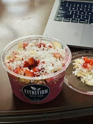 Bayside Bowl with dragonfruit base , mango, almond milk , topped with strawberries , sliced almonds, raw coconut, granola , honey