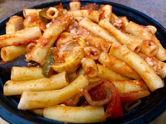 Penne pasta bowl with arrabiata sauce and sautéed vegetables