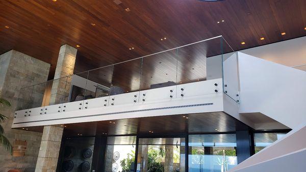 Interior glass railing on standoffs