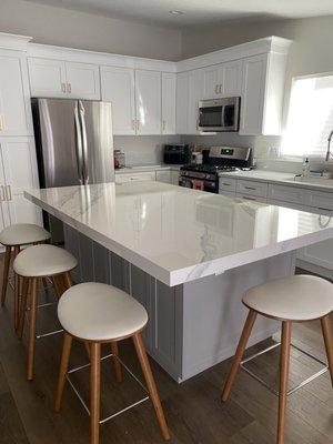 After, Dekton Olimpo island with Haze shaker cabinets