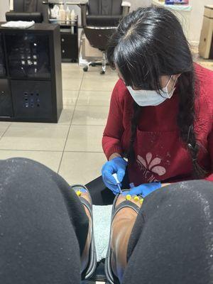 Nail tech's masked and gloved