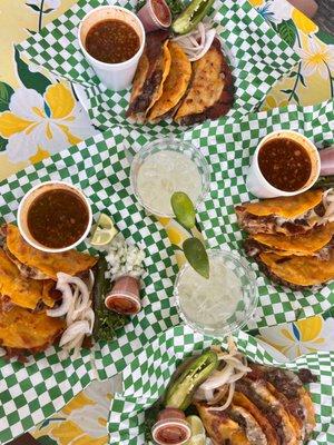 ig: @whatsviveating  |  plate of birria tacos, consommé, and draft mezcal margaritas