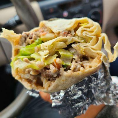 Super burrito with carne asada (steak) comes with meat, rice, beans, cheese, fresh salsa, guacamole, sour cream and lettuce!