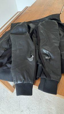 soft leather jacket ripped at both elbows