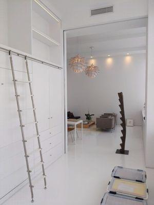 high ceilings and no trim paired with a seamless white epoxy floor for this minimalist Tribeca loft apartment