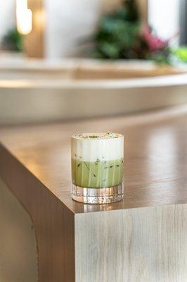 The Motcho Matcha cocktail features Tito's, matcha, and cream.